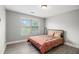 Bedroom with neutral walls, wood-look flooring, a ceiling fan and a sunny window view at 6086 Willowpond Ct, Douglasville, GA 30135