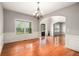 Sunlit dining room featuring hardwood floors, chair railing, and an elegant chandelier at 6086 Willowpond Ct, Douglasville, GA 30135