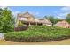 Beautiful two-story home with stone and siding, a welcoming front porch, and lush, mature landscaping at 6086 Willowpond Ct, Douglasville, GA 30135