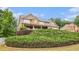 Beautiful two-story home with stone accents, covered porch, and mature landscaping at 6086 Willowpond Ct, Douglasville, GA 30135