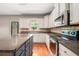 Bright kitchen with stainless steel appliances, granite countertops, and an island at 6086 Willowpond Ct, Douglasville, GA 30135