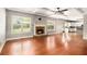 Inviting living room with a stone fireplace, hardwood floors, and coffered ceilings at 6086 Willowpond Ct, Douglasville, GA 30135