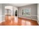 Spacious living room with hardwood floors, natural light, and arched doorway at 6086 Willowpond Ct, Douglasville, GA 30135