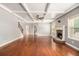 Open concept living room with fireplace, hardwood floors, and coffered ceilings at 6086 Willowpond Ct, Douglasville, GA 30135