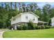Two-story home with a well-maintained lawn and a driveway leading to an attached garage at 757 Tall Deer Dr, Fairburn, GA 30213