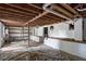 The unfinished basement offers potential for customization with exposed beams and block walls at 856 Bridgewater Sw St, Atlanta, GA 30310