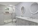 Elegant bathroom with a glass-enclosed shower and double vanity sinks at 856 Bridgewater Sw St, Atlanta, GA 30310