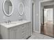 Bathroom featuring a double sink vanity and a view into the hallway at 856 Bridgewater Sw St, Atlanta, GA 30310