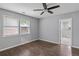 Bedroom with hardwood floors and view to updated bathroom with tiled shower at 856 Bridgewater Sw St, Atlanta, GA 30310