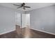 Bedroom with a ceiling fan, open doorway, and wood-look laminate flooring at 856 Bridgewater Sw St, Atlanta, GA 30310