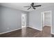 Bedroom with hardwood floors and view to updated bathroom and walk in closet at 856 Bridgewater Sw St, Atlanta, GA 30310