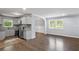 Well-lit kitchen flows to the dining area, with modern appliances and countertops at 856 Bridgewater Sw St, Atlanta, GA 30310