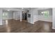 Open-concept living area with stylish flooring and a seamless flow to the kitchen at 856 Bridgewater Sw St, Atlanta, GA 30310
