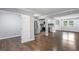 Open-concept living room boasts hardwood floors and stainless steel appliances in the adjacent kitchen at 856 Bridgewater Sw St, Atlanta, GA 30310