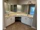 A bathroom vanity features double sinks, white cabinets, large mirrors and neutral walls at 125 Villa Park Cir, Stone Mountain, GA 30087