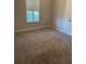 Bedroom featuring carpet flooring, a window with modern shutters, and a closet at 125 Villa Park Cir, Stone Mountain, GA 30087