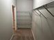 Spacious walk-in closet featuring wire shelving and carpet flooring, ideal for organized storage at 125 Villa Park Cir, Stone Mountain, GA 30087