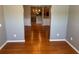 Open dining area with hardwood flooring offering a view into the adjacent kitchen at 125 Villa Park Cir, Stone Mountain, GA 30087