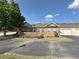 Charming single-story brick townhome with attached garage and meticulously manicured landscaping at 125 Villa Park Cir, Stone Mountain, GA 30087