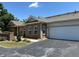 Attractive single-story brick townhome with an attached garage, showcasing its curb appeal at 125 Villa Park Cir, Stone Mountain, GA 30087