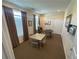 Bright game room with tables, chairs, and windows with wooden blinds at 125 Villa Park Cir, Stone Mountain, GA 30087