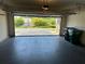 Open garage door providing access to the driveway and the surrounding neighborhood at 125 Villa Park Cir, Stone Mountain, GA 30087