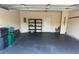 Spacious two-car garage with epoxy flooring and storage shelving at 125 Villa Park Cir, Stone Mountain, GA 30087