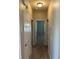 Hallway view showcases neutral walls and carpet, connecting various rooms within the home at 125 Villa Park Cir, Stone Mountain, GA 30087