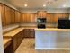 Spacious kitchen with ample counter space, wooden cabinets, and modern appliances at 125 Villa Park Cir, Stone Mountain, GA 30087