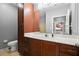 Bathroom featuring a sink, cabinetry, and a large mirror at 400 17Th Nw St # 1253, Atlanta, GA 30318