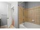 Bathroom featuring shower and bath with tiled walls at 400 17Th Nw St # 1253, Atlanta, GA 30318