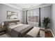 Cozy bedroom with a comfortable bed, soft lighting, and a large window for plenty of natural light at 400 17Th Nw St # 1253, Atlanta, GA 30318