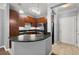 Well-equipped kitchen featuring dark cabinets, granite counters, and stainless steel appliances at 400 17Th Nw St # 1253, Atlanta, GA 30318