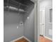 A functional laundry room featuring wire shelving and a convenient washing machine hookup at 400 17Th Nw St # 1253, Atlanta, GA 30318