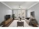 Comfortable living room with sleek furniture, plush rug, and bright natural light from the large windows at 400 17Th Nw St # 1253, Atlanta, GA 30318