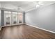 Spacious living room with hardwood floors and great natural light from the doors to the balcony at 400 17Th Nw St # 1253, Atlanta, GA 30318