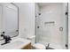 Clean bathroom featuring a walk-in shower, sleek vanity, and modern fixtures at 532 Rockbridge Rd, Lilburn, GA 30047