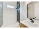 Modern bathroom featuring stylish tile work, a sleek vanity, and contemporary fixtures at 532 Rockbridge Rd, Lilburn, GA 30047