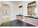 Double sink bathroom with modern fixtures and large mirrors, showcasing elegant design at 532 Rockbridge Rd, Lilburn, GA 30047