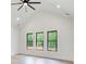A spacious bedroom offering bright natural light from multiple windows at 532 Rockbridge Rd, Lilburn, GA 30047