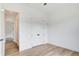 Bedroom featuring a closet, large window, and light hardwood floors at 532 Rockbridge Rd, Lilburn, GA 30047