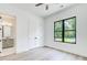 Bright bedroom with a modern window, closet, and ensuite bathroom, offering comfort and convenience at 532 Rockbridge Rd, Lilburn, GA 30047