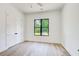 Neutral bedroom with a large window that lets in lots of light and a double door closet at 532 Rockbridge Rd, Lilburn, GA 30047