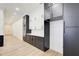Modern kitchen boasting lots of storage in the custom black and white cabinetry and stainless appliances at 532 Rockbridge Rd, Lilburn, GA 30047
