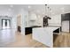 Luxurious kitchen features white quartz countertops, black cabinets, and stainless steel appliances at 532 Rockbridge Rd, Lilburn, GA 30047