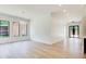 Bright open living area with three windows and modern lighting at 532 Rockbridge Rd, Lilburn, GA 30047