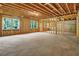 Unfinished basement featuring a concrete slab floor and studded walls around the perimeter at 297 Delta Dr, Mcdonough, GA 30252