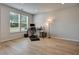This office space features wood floors and ample natural light from the large window at 297 Delta Dr, Mcdonough, GA 30252