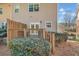 Exterior backyard showing a deck with wood railing, side of home, and green bushes at 506 Glen Ivy # 5, Marietta, GA 30062
