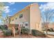 Exterior backyard showing a deck with wood railing, side of home, and green bushes at 506 Glen Ivy # 5, Marietta, GA 30062